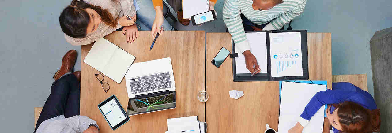 Group of creative business people having meeting from overhead